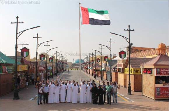 Global Village Raises The UAE Flag in Honor of National Flag Day