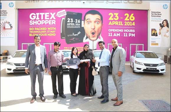 Four ecstatic GITEX Shopper Spring winners drive off in a Limited Edition Honda Accord