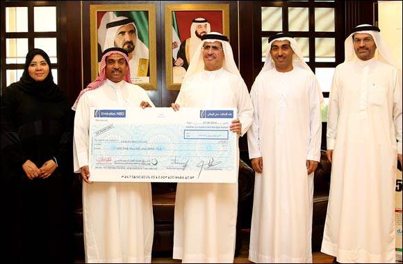 DEWA hands its AED 5 million Water Aid donation cheque to the Emirates Red Crescent